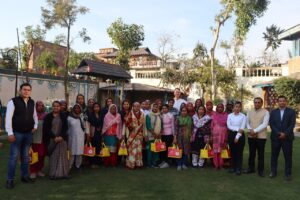 Namaste Dwaar staff gathered outdoors for Women's Day celebration